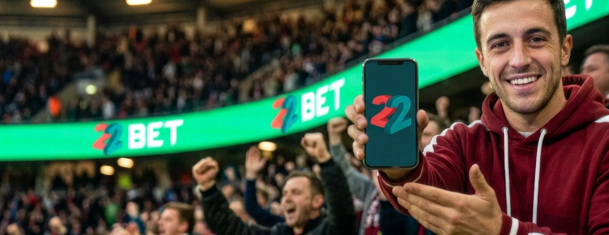A fan showing the 22Bet app at a stadium