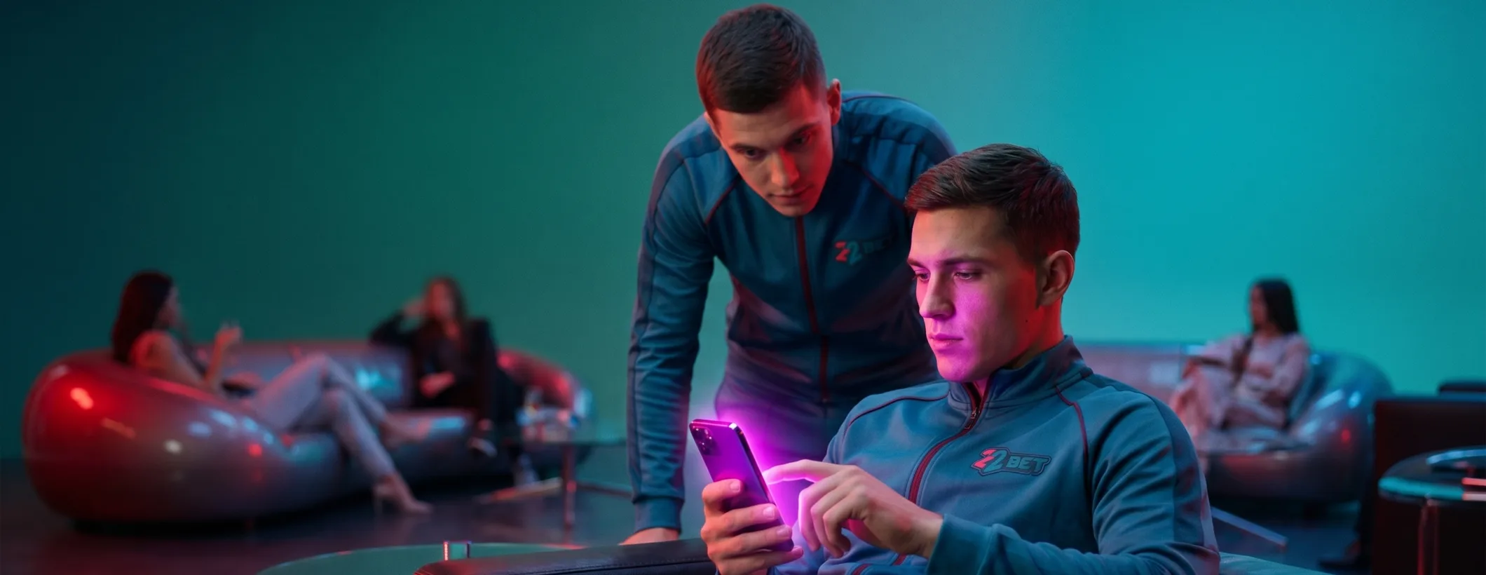 Two friends following a live bet on the 22Bet app